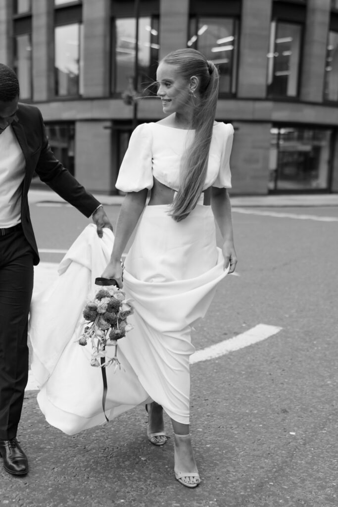 black and white photo of chic modern wedding dress with elegant bow detail