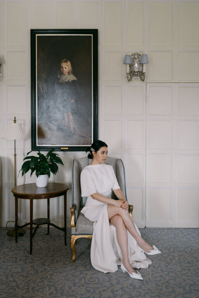 bride in elegant high-neck wedding dress with open back