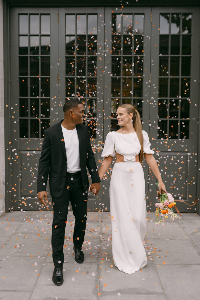 Bride and groom celebrating with confetti