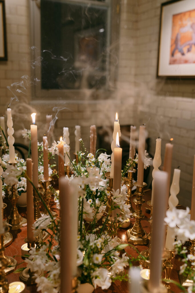 Wedding dinner table setting with tall candles