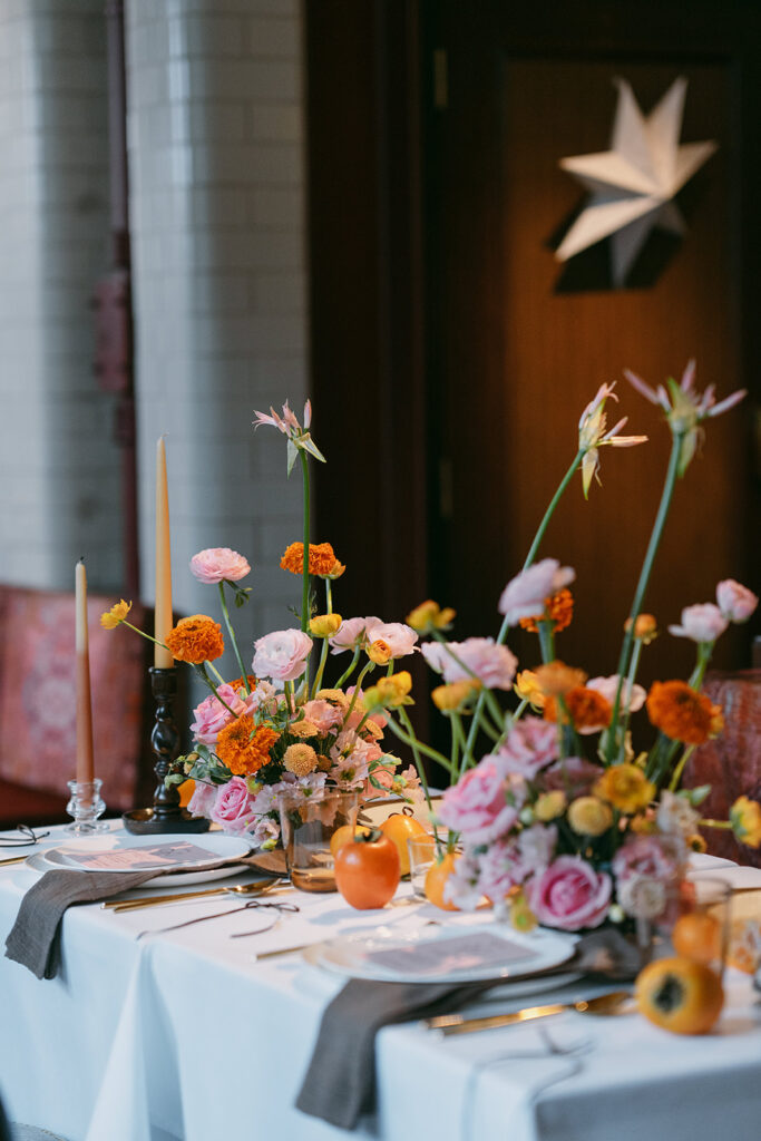 Wedding table with lots of colorful and vibrant florals to set the mood