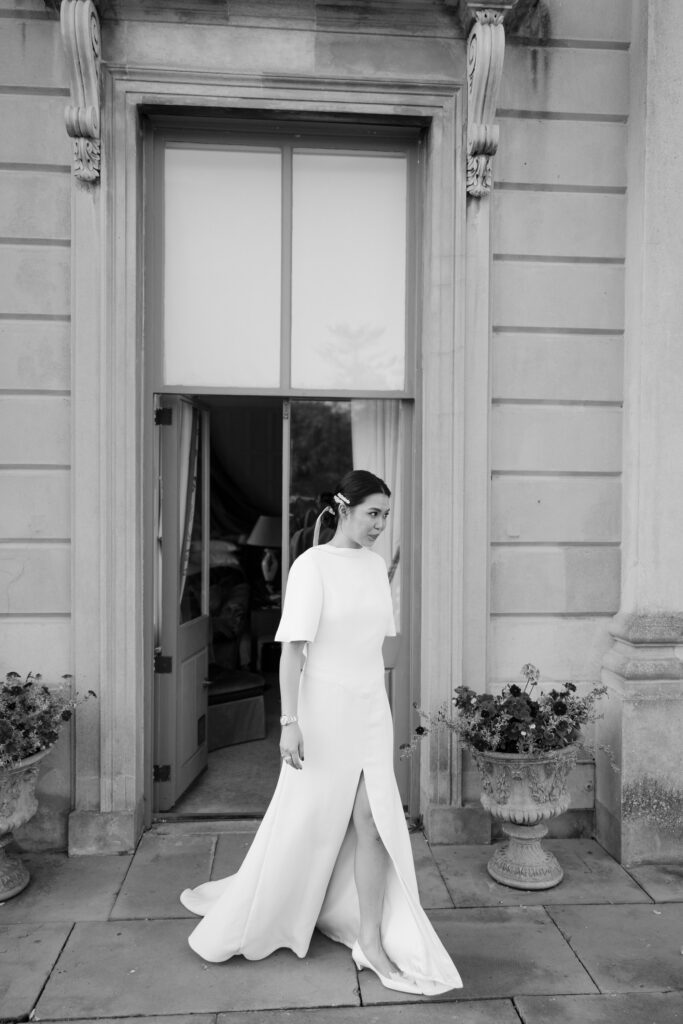 Bride going up to the groom for first look at Cliveden House
