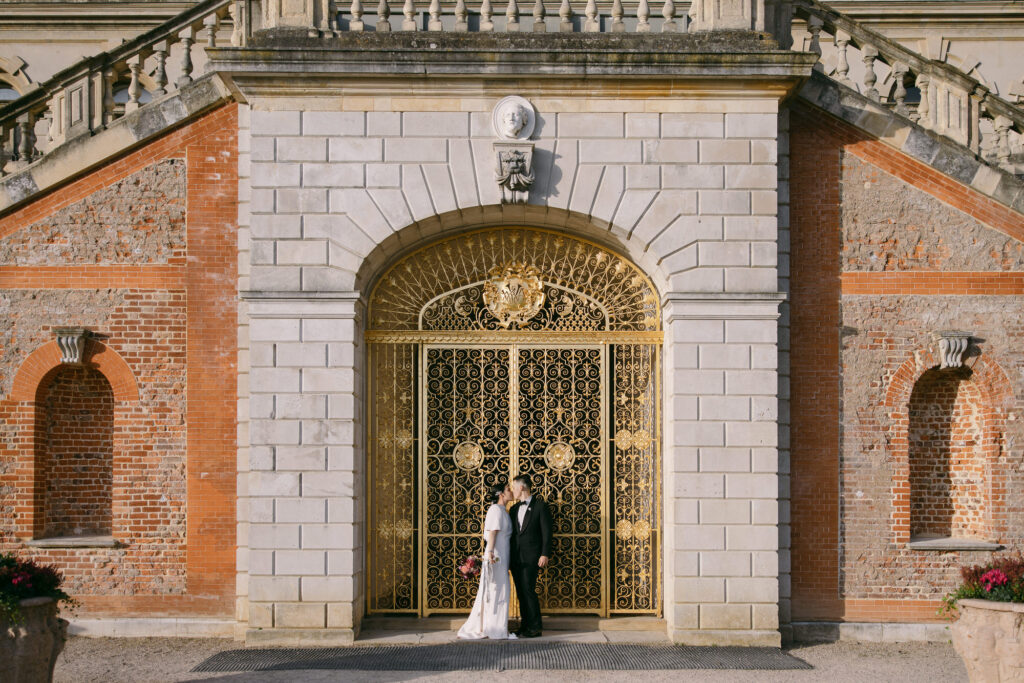 Bride and groom posing for a picture at Cliveden House